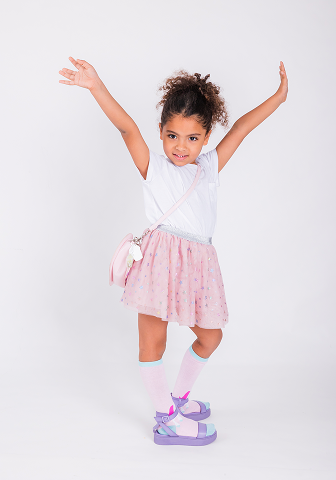 A girl raising her hands in excitement